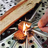 Roasting sticks over a fire grate.